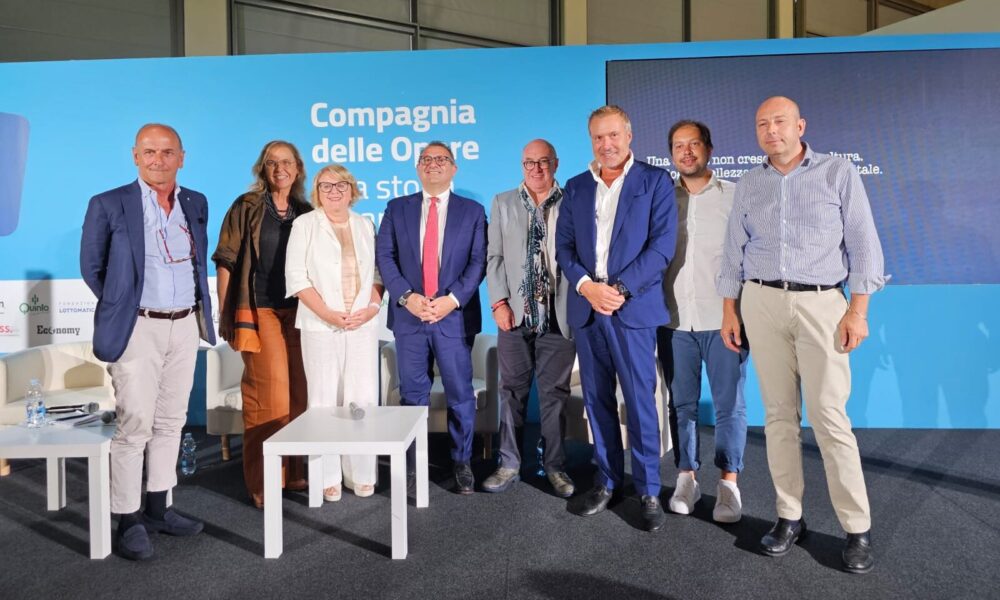 Foto di gruppo con l'assessore regionale alle Attività produttive e Turismo, Sergio Emidio Bini, intervenuto al Meeting di Rimini