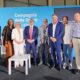 Foto di gruppo con l'assessore regionale alle Attività produttive e Turismo, Sergio Emidio Bini, intervenuto al Meeting di Rimini